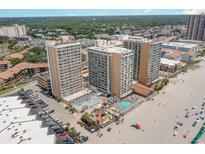Aerial view of oceanfront resort complex with multiple buildings, pools, and beach access at 9550 Shore Dr. # 229, Myrtle Beach, SC 29572