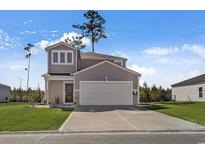 Two-story house with gray siding, white garage door, and a well-maintained lawn at 161 Saddle St, Conway, SC 29527