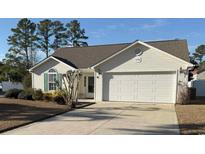 Charming one-story home features a well-maintained lawn, attached garage, and classic curb appeal in a tranquil neighborhood at 179 Wiltshire Ct., Longs, SC 29568