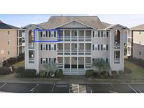 Coastal-style condo building with multiple units and balconies at 1900 Duffy St. # C-7, North Myrtle Beach, SC 29582