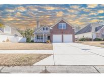 Brick home with two-car garage and manicured lawn at 217 Appian Way, Myrtle Beach, SC 29588