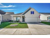 Charming one-story home with landscaped lawn and attached garage at 2809 Spain Ln., Conway, SC 29527