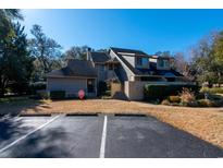 Attractive exterior of a two-story condo with parking at 306 Westbury Ct. # 2-A, Myrtle Beach, SC 29572