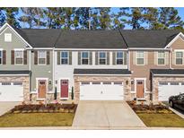 Three-unit townhome development showcasing attractive exteriors and landscaping at 324 Golan Circle # B, Myrtle Beach, SC 29579