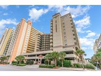 Oceanfront building with parking and tropical landscaping at 501 S Ocean Blvd. # 304, North Myrtle Beach, SC 29582