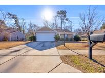 Charming one-story home featuring a two-car garage, well-kept lawn, and inviting curb appeal at 1240 Pineridge St., Conway, SC 29527