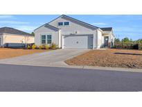 Charming one-story house with attached garage and well-maintained landscaping at 144 Rutland Ct., Conway, SC 29526