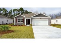 Gray-toned house with a white garage door and landscaping at 207 Jeff Waters Circle, Longs, SC 29568