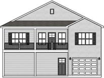 Two-story home with gray siding, balcony, and attached garage at 2426-B Park St., North Myrtle Beach, SC 29582