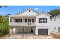Two-story home boasts a welcoming front porch and a convenient drive-under garage at 2428 Park St., North Myrtle Beach, SC 29582