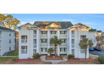 Charming condo complex featuring multiple balconies, lush landscaping, and well-maintained exterior at 661 Tupelo Ln. # 16B, Longs, SC 29568