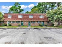 Brick triplex with red tile roofs and ample parking at 1025 Carolina Rd. # I-7, Conway, SC 29526