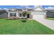 One-story home with brick accents and a two-car garage at 120 Telfair Rd., Georgetown, SC 29440