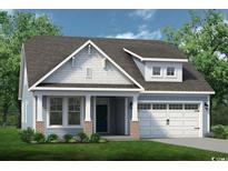 One-story home with light blue siding, brick accents, and a two-car garage at 135 Little Cedar Dr., Loris, SC 29569