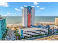 Oceanfront high-rise building with parking and pool area at 1605 S Ocean Blvd. # 810, Myrtle Beach, SC 29577
