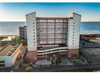 Oceanfront condo building with parking and nearby beach at 1706 S Ocean Blvd. # 805, North Myrtle Beach, SC 29582