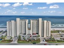 Oceanfront condo building with parking and beach access at 1990 N Waccamaw Dr. # 1109, Garden City Beach, SC 29576