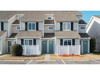 Attractive townhouse exterior with a well-maintained front yard and landscaping at 200 Deer Creek Rd. # G, Myrtle Beach, SC 29575