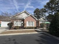 Brick front exterior of charming home with landscaping and patio at 2017 Rimsdale Dr. # J-3, Myrtle Beach, SC 29575