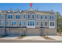 Three-story townhome with two-car garage and neutral color scheme at 2557 Pete Dye Dr. # 903, North Myrtle Beach, SC 29582