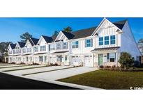 Row of charming townhouses with white exteriors and green accents at 277 Bent Green Ct. # 76F, Murrells Inlet, SC 29576