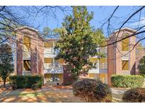 Brick building with balconies and landscaping at 4239 Villas Dr. # 609, Little River, SC 29566