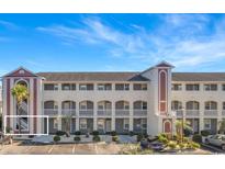 Condo with well-maintained landscaping, private parking and exterior staircase access at 4518 N Plantation Harbour Dr. # G-1, Little River, SC 29566