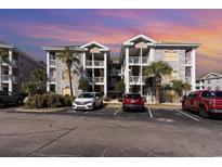 Brick building exterior with parking and landscaping at 4773 Wild Iris Dr. # 5-202, Myrtle Beach, SC 29577