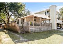Single-story home with large deck and fenced yard at 6001-Mh53 S Kings Highway, Myrtle Beach, SC 29575