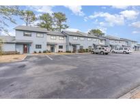 Exterior view of townhouses with parking and landscaping at 775 Plantation Dr. # 48, Little River, SC 29566