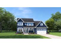 Two-story home with a navy blue exterior, white trim, and a two-car garage at 8014 Lotus Dr, Myrtle Beach, SC 29579