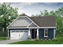 Two-story home with a two-car garage and a landscaped yard at 815 Big Cedar Dr., Loris, SC 29569