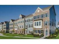 Row of charming 3-story townhouses with gray, blue, and brown siding at 8579 Balmy Breeze Pl. # 43, Myrtle Beach, SC 29572