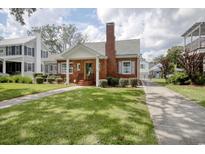 Brick home with walkway, landscaping, and driveway at 104 East Bay St., Georgetown, SC 29440