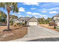Brick house with attached garage and palm tree in front yard at 415 Britt Ct., Conway, SC 29526