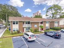 Brick building with ample parking and nearby ocean views at 7602 Porcher Dr. # C, Myrtle Beach, SC 29572