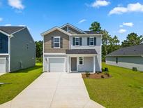 Two-story house with gray siding, a gray roof and a two-car garage at 1041 Kinness Dr., Conway, SC 29527