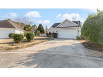 Gray house with a two-car garage and a basketball hoop at 1209 Peyton Ct., Myrtle Beach, SC 29588