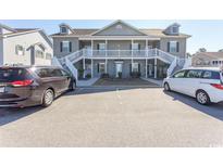 Two-story townhome exterior with parking and landscaping at 249 Moonglow Circle # 201, Murrells Inlet, SC 29576