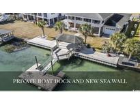 Waterfront home featuring a private boat dock with gazebo and new sea wall at 3545 Marion Ln., Murrells Inlet, SC 29576