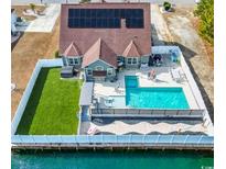 Luxury home with pool, dock, and solar panels at 400 Dog Pen Ct., Myrtle Beach, SC 29579