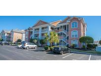 Attractive condo building with ample parking and landscaping at 4625 Lightkeepers Way # L, Little River, SC 29566