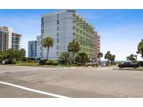 Oceanfront building with parking and palm trees at 7000 N Ocean Blvd. # 326, Myrtle Beach, SC 29572