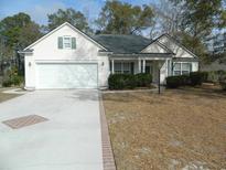 One-story house with attached garage and manicured lawn at 80 Prentice Ct., Pawleys Island, SC 29585