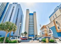 Lovely exterior of a beachfront building with a view of multiple parking spots, palm trees, and The Breakers Resort signage at 2106 N Ocean Bl N Ocean Blvd. # 211, Myrtle Beach, SC 29577