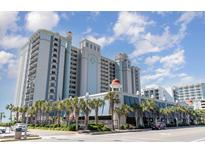 Oceanfront high-rise building with palm trees and ample parking at 2311 South Ocean Blvd. # 371, Myrtle Beach, SC 29577