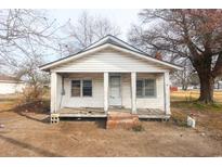White frame house with front porch needs renovation at 4151 Maple St., Loris, SC 29569