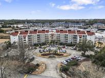 Expansive resort featuring waterfront condos, boat docks, and ample parking with beautiful views of the waterway and the ocean at 4390 Bimini Ct. # 206-C, Little River, SC 29566