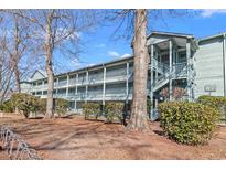 Two-story building with multiple balconies and landscaping at 5905 S Kings Hwy. # 4103, Myrtle Beach, SC 29575