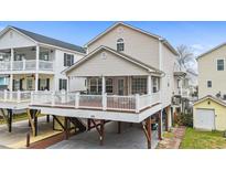 Inviting beach home featuring a large deck and outdoor entertaining space at 6001- P04 S Kings Highway, Myrtle Beach, SC 29575